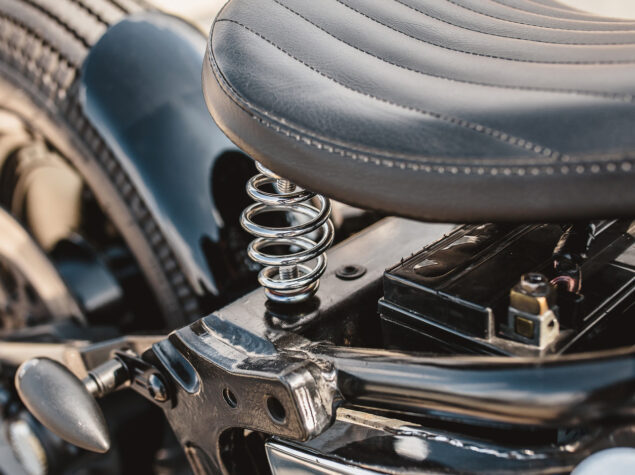 Leather motorcycle seat with springs - close-up